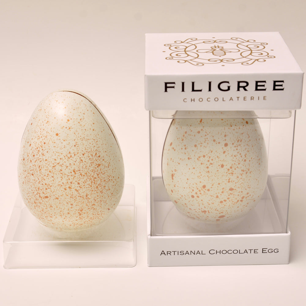 
                  
                    White and Gold Painted Egg
                  
                